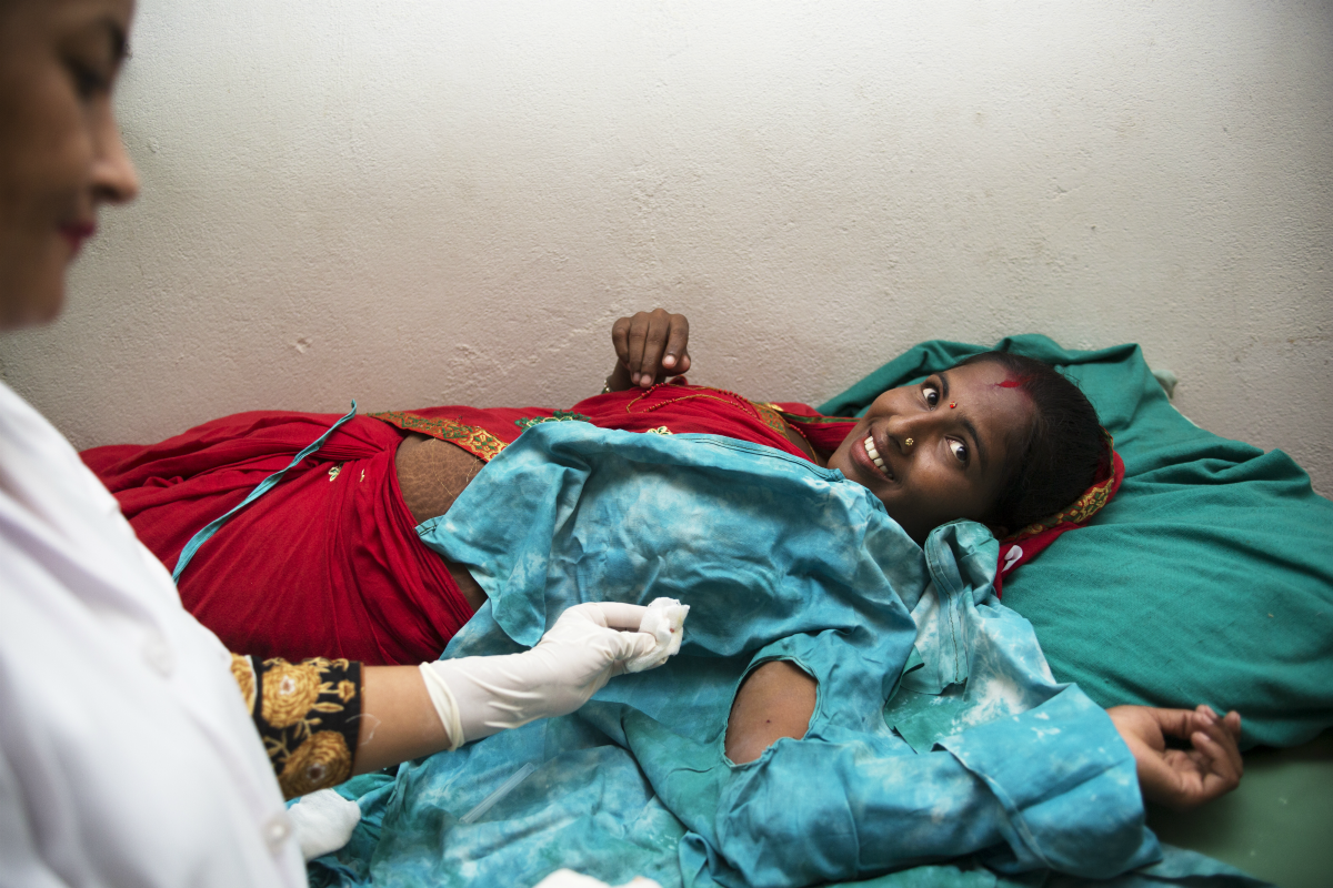 Muna receiving her implant