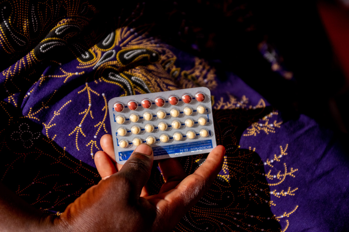 Client holing the pill.