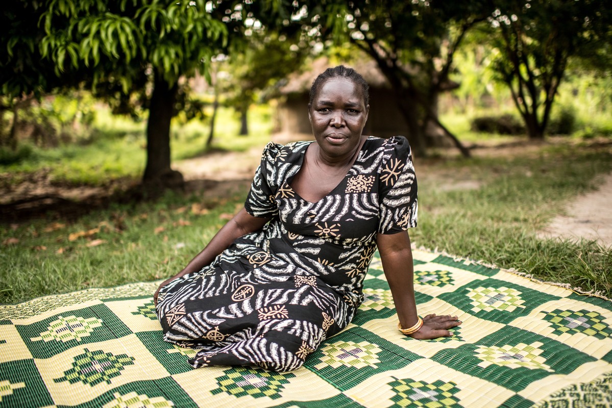 Woman sitting down.