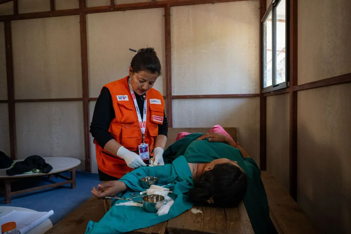 A health worker delivers services after the Nepal earthquake