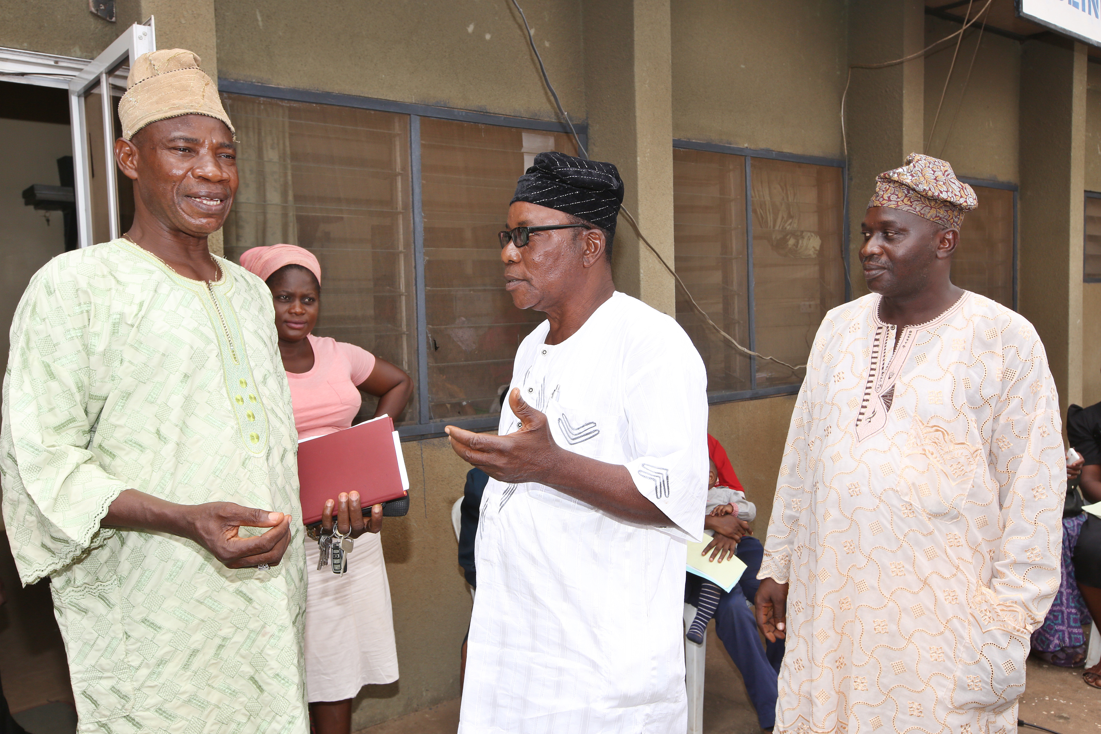 Male faith workers talking in a group