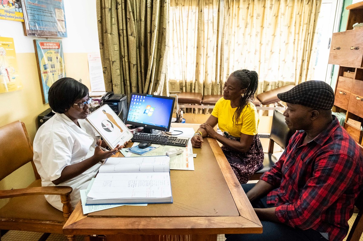 Ami, 45, and Yaori Ajossou, 56, at the ATBEF clinic in Lomé for a check up with the midwife. Mr Yaori Ajossou