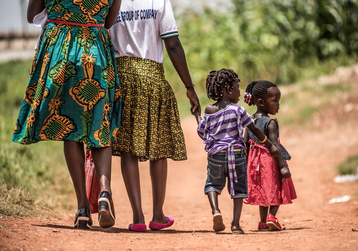 parents walking with small children