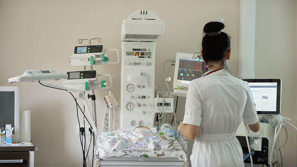 A newborn baby receives care shortly after birth.