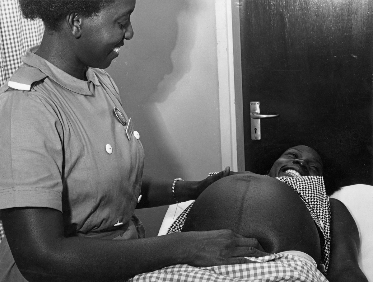 Pregnant women receiving a pre-natal check up at a clinic in Katwe. Uganda, 1970.