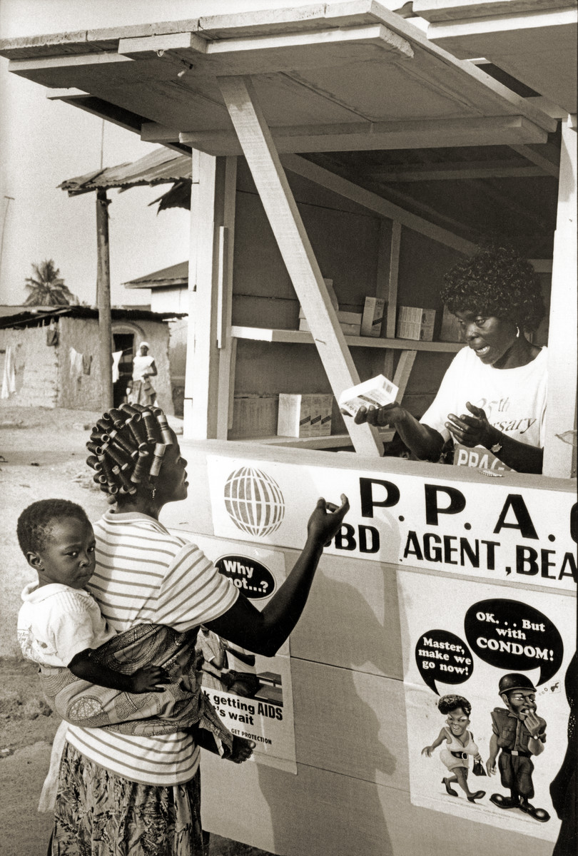 Beaha refugee camp; woman and baby visiting community outreach worker Sarah Andok. Ghana, 1994