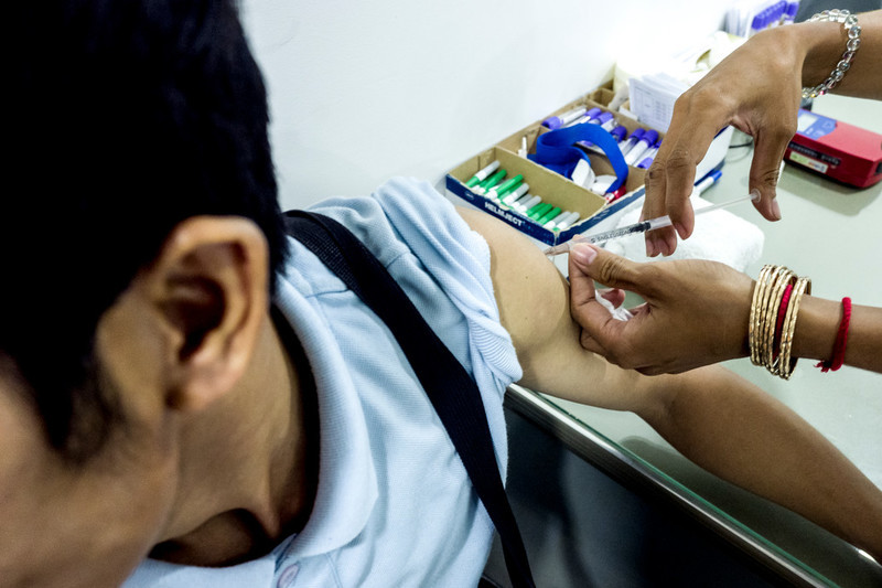 29-year-old Borin receives a Hepatitis B vaccination during a check-up at the RHAC clinic. While most of the patients attending RHAC clinics are women, there has been an increase in the number of young men seeking treatment and consultation.  