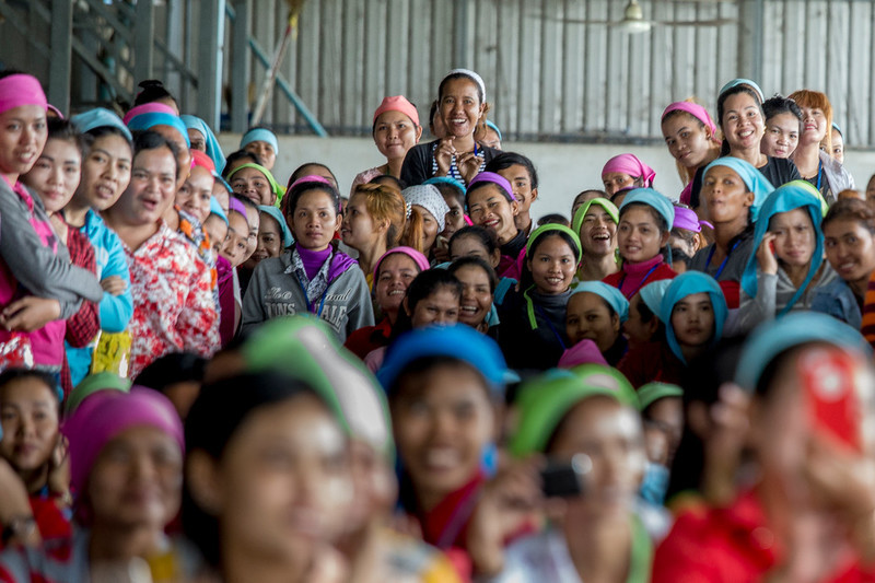 Employees gather to enjoy a music concert during a health day event organized by RHAC at the Propitious garment factory.
