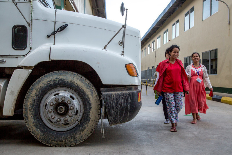 Pregnant garment workers head home after finishing their shift at the Dewhirst Garment Factory. Pregnant employees are not required to wear their uniform during their working shift and are allowed to finish their shift several minutes ahead of the rest of the workers. 