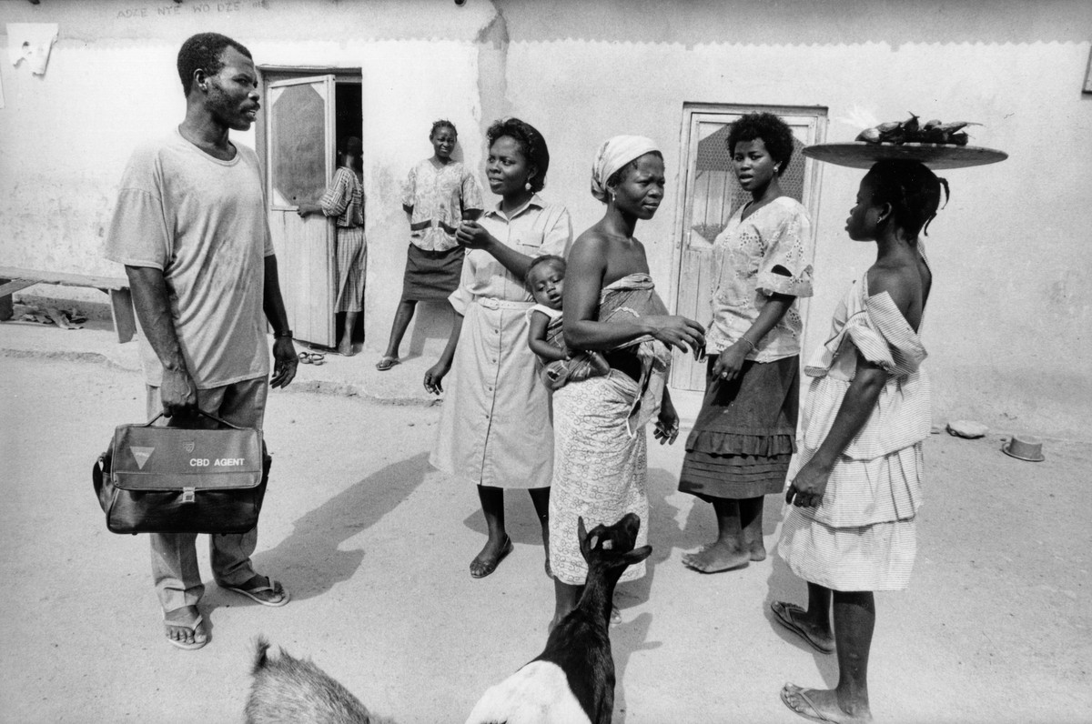 A community outreach officer visiting a local village. Ghana, c1978