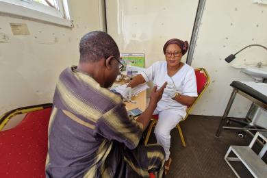 Two people sat in a medical office