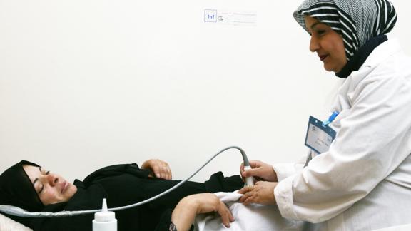 women and health officer during medical exam