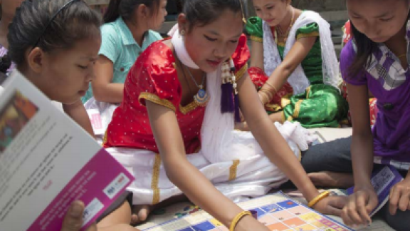 Girls gather to do a workshop