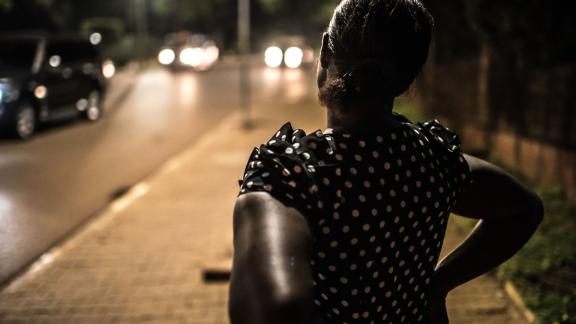 Deborah, a sex worker and beneficiary of the Lady Mermaid's Bureau project, at night in central Kampala.