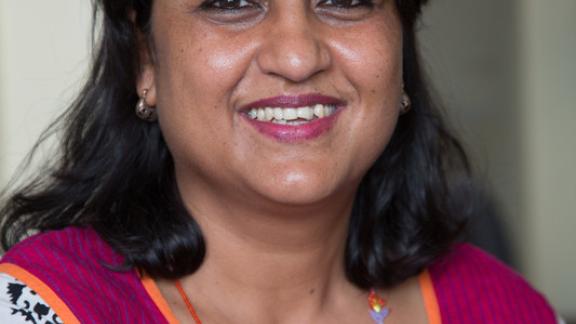 Female staff smiling. 