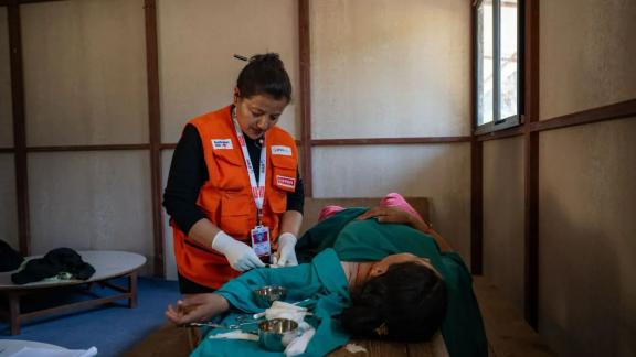 A health worker delivers services after the Nepal earthquake